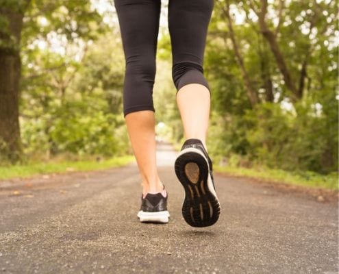 Runner runs on trail, one of nine beginner running tips.