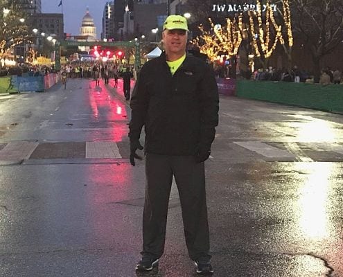 Frank Scalet, SAG driver, poses before the 2019 Austin Marathon.