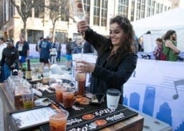 Image of a bartender pouring a drink with Tito's Handmade Vodka at the 2019 Austin Marathon Hilton VIP Experience.