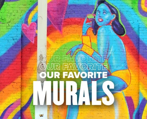 Image of a vibrantly colored Austin mural of a blue female genie drinking a martini. This blog showcases some of the Austin Marathon's favorite on-course murals.