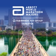 Drone image of runners crossing Congress Avenue Bridge during the 2020 Ascension Seton Austin Marathon with the Austin skyline in the background. The design contains the Abbott World Marathon Majors logo and text that introduces the Austin Marathon as an official AbbottWMM Wanda Age Group World Rankings qualifier.