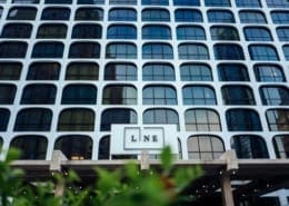 Building with "LINE" sign and arched windows