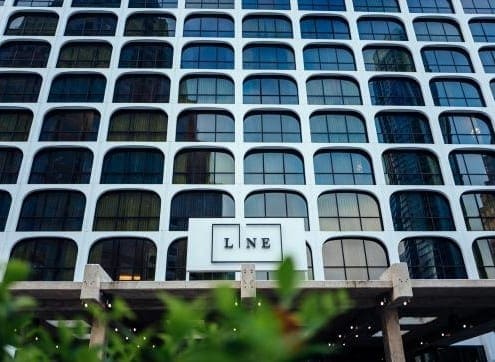 Building with "LINE" sign and arched windows