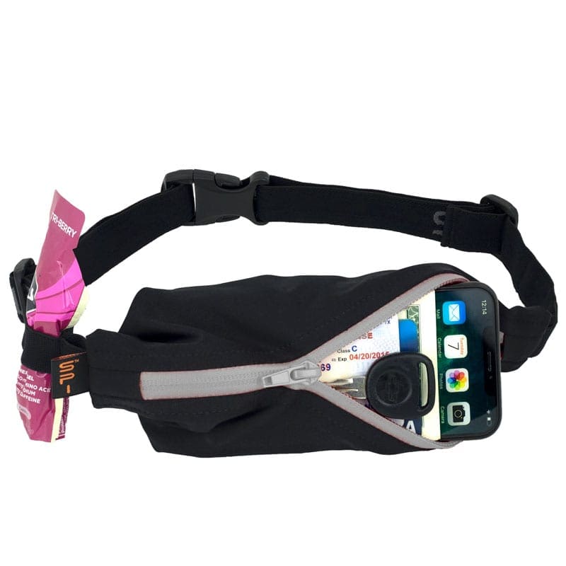 Image of a SPIbelt holding a phone in its pocket and a gel in the clip. A good running belt is nice to have when you start marathon training. Read about more items you need at https://youraustinmarathon.com/items-to-start-marathon-training/