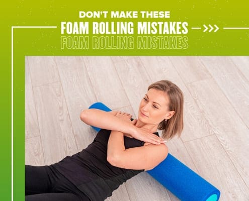 Female rolls her back on a blue foam roller. Text on design reads Don't Make These Foam Rolling Mistakes. Learn more at https://youraustinmarathon.com/foam-rolling-mistakes/