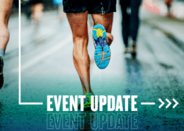 Runner's shoe mid-stride on wet pavement