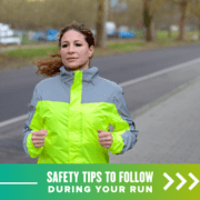 Female runner runs on the road against traffic wearing a bright yellow high-visibility jacket. Text on design reads Safety Tips to Follow During Your Run. Read more at http://48d.435.myftpupload.com/running-safety-tips/
