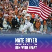 958921_AustinMarathonRunWithHeartforDellChildrens_012721 Nate Boyer leads the Texas Longhorns onto the field carrying the American flag. Text on design reads Nate Boyer Invites You to Run with Heart. Learn more at http://48d.435.myftpupload.com/join-nate-boyer-run-with-heart/