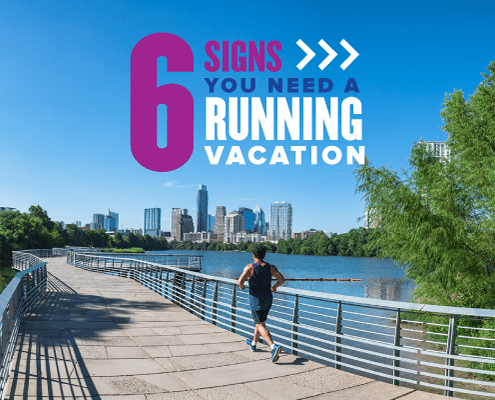 A runner jogs on the trail around Town Lake with the Austin skyline in the background. Text on design reads 6 Signs You Need a Running Vacation. Read more about why you need a runcation at http://48d.435.myftpupload.com/you-need-a-runcation/