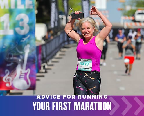 Female runner excitedly runs towards the finish line with her hands in the air. Text on design reads Advice for Running Your First Marathon. Read more at http://48d.435.myftpupload.com/running-your-first-marathon/