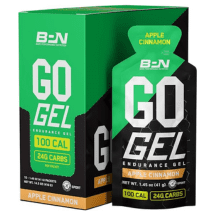 Box and packet of BPN GO Gel Endurance Gel in Apple Cinnamon flavor, featuring green, white, and black packaging with orange accents. The packet highlights "100 Cal" and "24G Carbs" with "Made in the USA" noted on the box – a great addition to any Father’s Day gift guide for running gifts. Austin Marathon Half Marathon & 5K