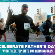 A man in athletic gear and sunglasses runs in the Austin Marathon with other participants in the background. The image features a banner with the text "Celebrate Father's Day with These Top Running Gifts for Dads. Austin Marathon Half Marathon & 5K