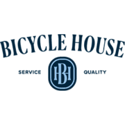 Bicycle House logo featuring the business name in curved, bold, dark blue text, with the words 'Service' and 'Quality' flanking a central circular emblem containing stylized letters 'BH' on a blue background. The design subtly acknowledges our sponsors through its professional craftsmanship. Austin Marathon Half Marathon & 5K