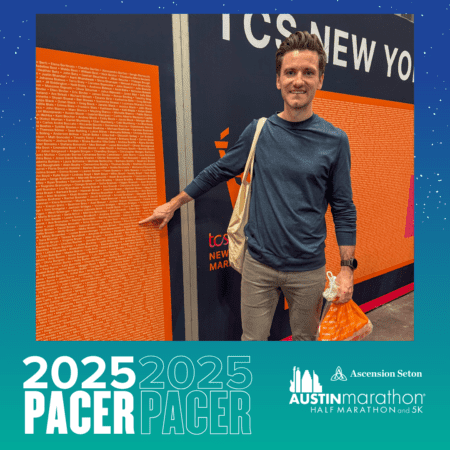 A man stands smiling and pointing at a large wall filled with text, representing the enthusiastic spirit of the Pacer Group. He holds an orange bag in his other hand as graphics promote the 2025 Austin Marathon and events, all set against a vibrant teal and orange color scheme. Austin Marathon Half Marathon & 5K