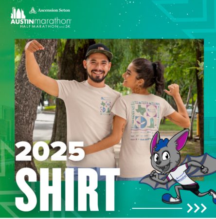 A man and woman smiling and posing back-to-back outdoors, both wearing beige T-shirts with colorful designs celebrating the 2025 Austin Marathon. A cartoon bat superhero adorns the bottom. Perfect for running enthusiasts to wear at Packet Pick Up during the marathon expo. Text reads "2025 SHIRT". Austin Marathon Half Marathon & 5K