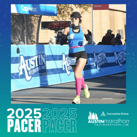 A runner in a blue tank top and pink leg warmers crosses the finish line at the Austin Marathon alongside their Pacer Group. A time display reads 1:32:03 above, while event branding and a cheering section energize the background. Austin Marathon Half Marathon & 5K