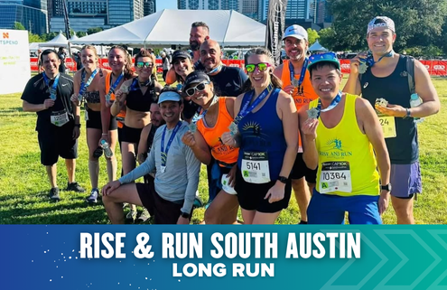 A group of smiling runners pose outdoors with medals after completing the Rise & Run South Austin Long Run, part of the vibrant Run Austin community, with a city skyline and white event tent in the background. Austin Marathon Half Marathon & 5K