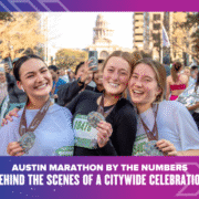 Three smiling runners proudly hold up their medals after completing the Austin Marathon, with the Texas State Capitol visible in the background and a citywide celebration unfolding around them. Austin Marathon Half Marathon & 5K