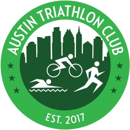 Green circular logo for Austin Triathlon Club with city skyline silhouette, icons of swimming, cycling, and running—perfect for those seeking Austin running groups or free group runs. "Austin Triathlon Club" tops the logo, with "Est. 2017" at the bottom. Austin Marathon Half Marathon & 5K