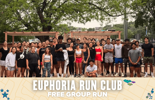 A large, diverse group of people in athletic wear poses and smiles outdoors under trees. Below, a banner reads: "Euphoria Run Club Free Group Run"—inviting all to join this energetic, free group run filled with stars, shoes, and music notes. Austin Marathon Half Marathon & 5K