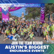 A large group of people in safety vests poses and celebrates at the finish line of the Austin Marathon, with confetti falling and the Texas State Capitol visible. Text reads: "Join the endurance team behind Austin’s biggest sports events. Austin Marathon Half Marathon & 5K