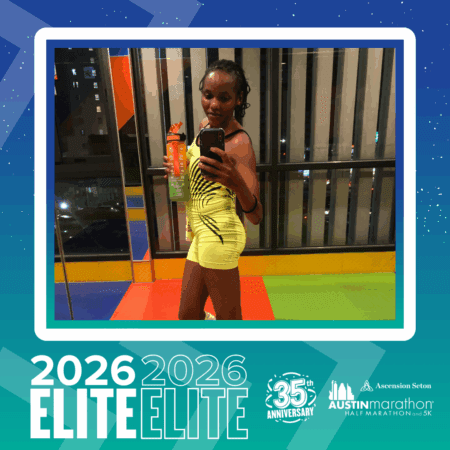 A woman in a yellow athleisure outfit takes a mirror selfie indoors, holding a water bottle. The image is framed with