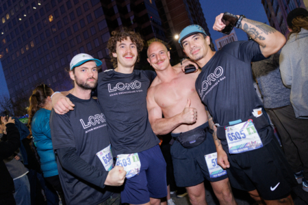 Four runners posing together before a race Four runners posing together before a race