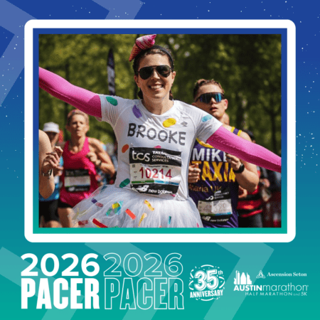 A smiling marathon runner in a colorful tutu and shirt labeled