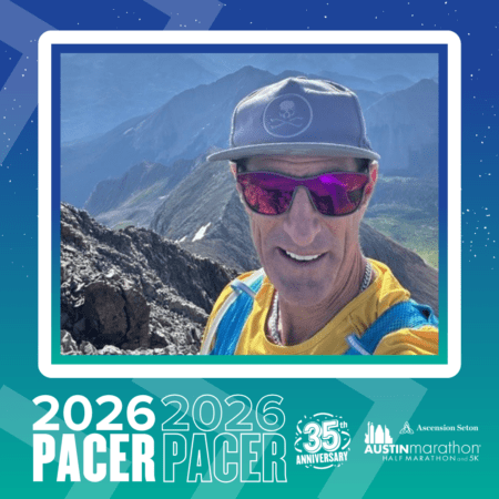 A man in a cap, sunglasses, and yellow shirt takes a selfie on a mountain trail. The image promotes the 2026 Austin Marathon & 5K with