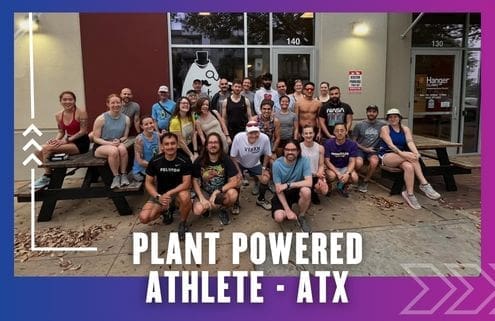 A large group of people in athletic wear smile and pose together outside a building with glass doors, representing the Buda Running Club. Text at the bottom reads, "Plant Powered Athlete - ATX." The border is purple and blue with white graphic arrows. Austin Marathon Half Marathon & 5K