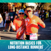 Two runners in red shirts giving thumbs-up