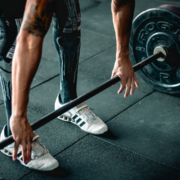 Athlete preparing to deadlift with barbell