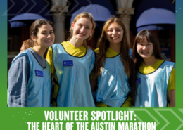 Four smiling marathon volunteers in blue vests