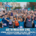 A large, diverse group of smiling marathon runners poses at the starting line in Austin. Text reads: “Austin Marathon Gives Opens Applications for 2027 Charity Partner Program.”. Austin Marathon Half Marathon & 5K