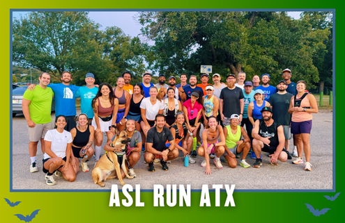 A large group of people and a dog pose outdoors in athletic wear, smiling for a group photo before a Group Run. The bottom of the image reads “ASL RUN ATX” with blue bat silhouettes in the corners. Austin Marathon Half Marathon & 5K
