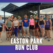 A diverse group of people and two dogs stand and smile together outdoors under a pavilion in South Austin, wearing athletic clothing. Text reads “EASTON PARK RUN CLUB” at the bottom of the image. Austin Marathon Half Marathon & 5K