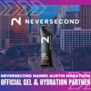 A Neversecond C30 energy gel is displayed over a vibrant cityscape with text: “NEVERSECOND named Austin Marathon official gel & hydration partner.” The Neversecond logo appears at the top, highlighting their commitment to optimal hydration for every marathon runner. Austin Marathon Half Marathon & 5K