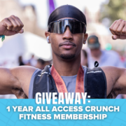 A person wearing sunglasses and flexing their arms stands outdoors. Text reads: “GIVEAWAY: 1 YEAR ALL ACCESS CRUNCH FITNESS MEMBERSHIP.” Blue accents and bat illustrations appear at the bottom, highlighting your chance to win a Spibelt in this exciting giveaway. Austin Marathon Half Marathon & 5K