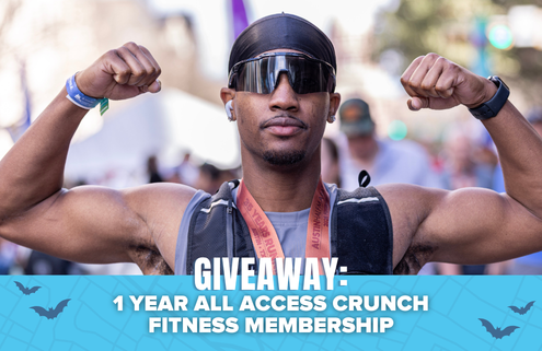 A person wearing sunglasses and flexing their arms stands outdoors. Text reads: “GIVEAWAY: 1 YEAR ALL ACCESS CRUNCH FITNESS MEMBERSHIP.” Blue accents and bat illustrations appear at the bottom, highlighting your chance to win a Spibelt in this exciting giveaway. Austin Marathon Half Marathon & 5K