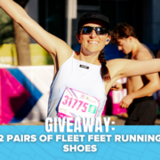 A smiling runner with arms raised wears a race bib and sunglasses at an outdoor event. Text on image reads: “GIVEAWAY: 2 PAIRS OF FLEET FEET RUNNING SHOES.” Don’t miss your chance to enter the Spibelt contest for a chance to win Spibelt gear along with this amazing giveaway!. Austin Marathon Half Marathon & 5K