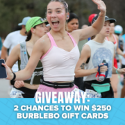 A smiling woman in athletic wear holds a phone and runs in a race with others, all hoping to win big. Text at the bottom reads, “GIVEAWAY: 2 CHANCES TO WIN $250 BURBLEBO GIFT CARDS.” Blue background has small bats, setting the scene for an exciting Neversecond Marathon Race Packs giveaway. Austin Marathon Half Marathon & 5K