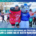 A runner in a strawberry jam costume stands next to a person in a blue wolf mascot suit at the Austin Marathon, sponsored by Ascension Seton, with cheering participants in the background. Text below promotes GOOD GOOD as the official jam and goodie bag. Austin Marathon Half Marathon & 5K
